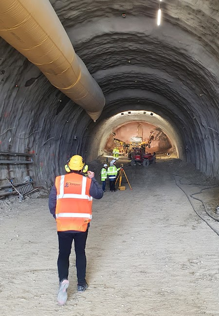 Engineers walking in the tunnel during construction