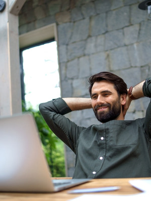 Relaxed engineer at a laptop