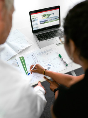 Engineers reviewing plans and monitoring data
