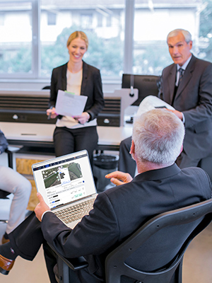 Business meeting reviewing project data